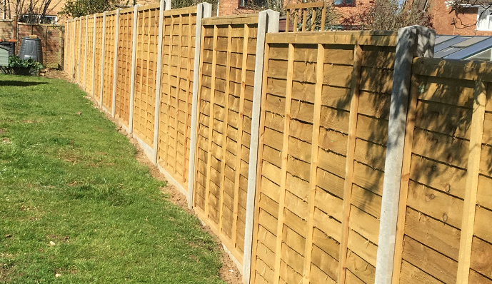 6ft Lap Panel fence slotted into concrete posts.
